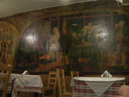 restaurant with murals on the wall
