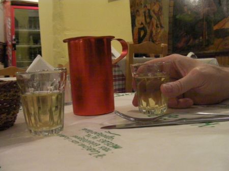 a one half kilo carafe of retsina wine and two shot glasses