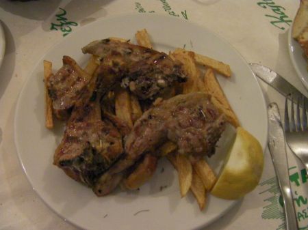 lamb chops on a bed of fries