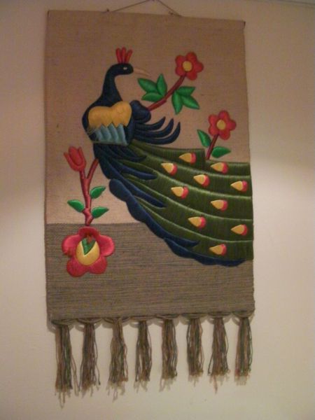 Peacock textile wall hanging
