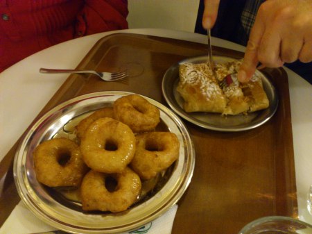 Donuts six donuts on a plate, one rectangular pastry on a plate