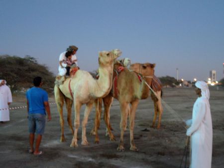 FortFriday2 man and small boy riding a camel