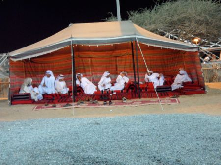 FortFriday6 men resting in a tent