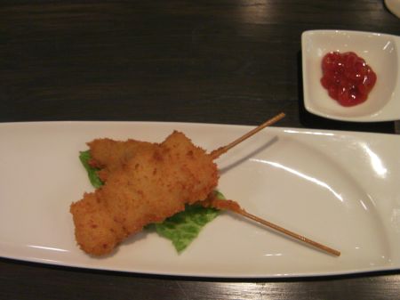 Skewer breaded oyster meats on a skewer