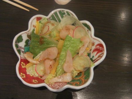 Salad oyster meats in a green salad