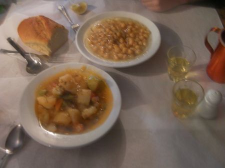 a bowl of vegetable stew and a bowl of chick peas