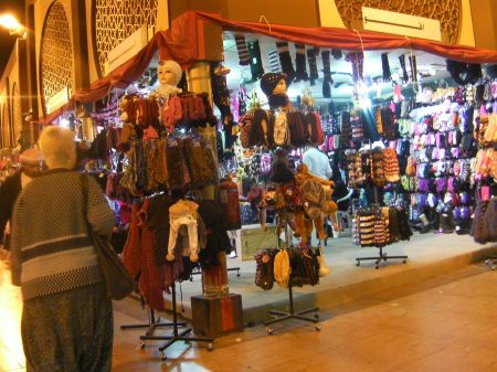 Stocking Caps and Mittens booth selling stocking caps, scarves, gloves, and mittens