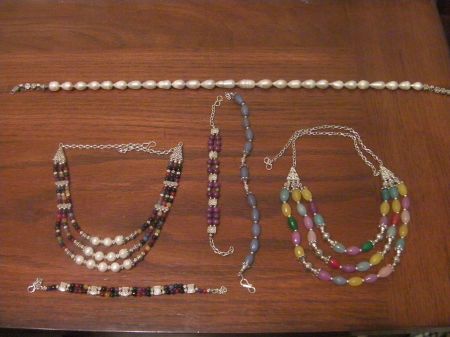 Necklaces three necklaces and three bracelets, some with pearls, others with multicolored stones