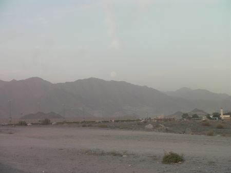 the Moon just above the hills of Fujairah about to disappear