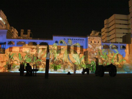 Greenery garden scene projected on the side of the fort