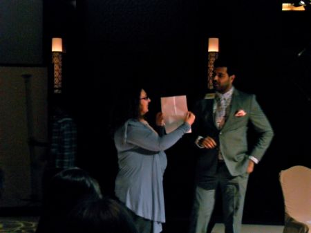 Wyne Poetry woman holding paper for man