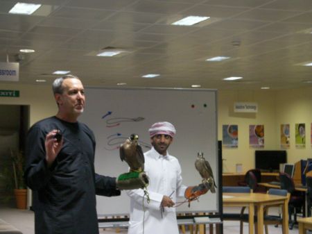 two men, two falcons