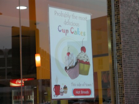 sign boasting that the cupcakes are probably the most delicious 