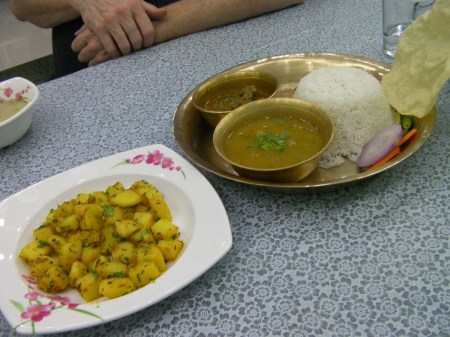 Chicken Rice and Aloo Jeera Fry cubed potatoes with parsley, rice with lentil soup and chicken