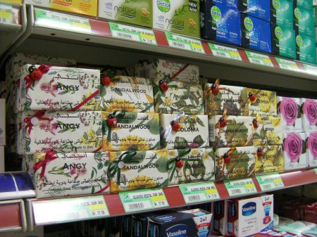 Handcrafted Soap store shelf displaying several flavors of handcrafted soap