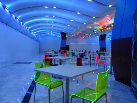 mall food court with tables and chairs but no restaurants