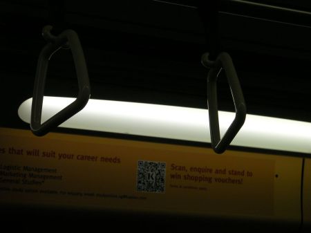 qr code in a college advertisement in the train car