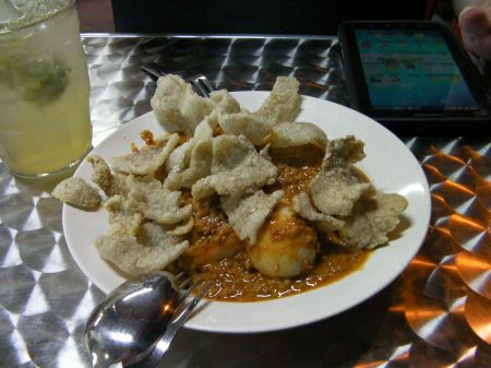 bowl of peanut sauce, hard boiled eggs, tofu