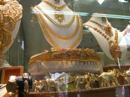 gold necklaces and elephant statues