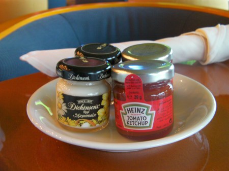 Condiments ketchup & mayonnaise in miniature jars