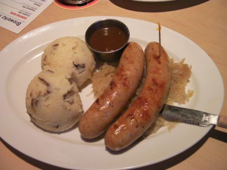 mash potatoes, two sausages, sauerkraut