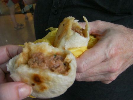two pork buns partially eaten