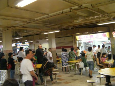 people lined up at a food booth