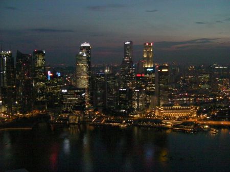 skyscrapers across the bay lit up after dark