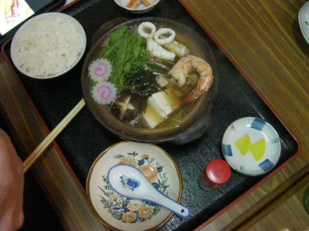Soup soup containing mushroom, shrimp, oyster, calamari, tofu, and more