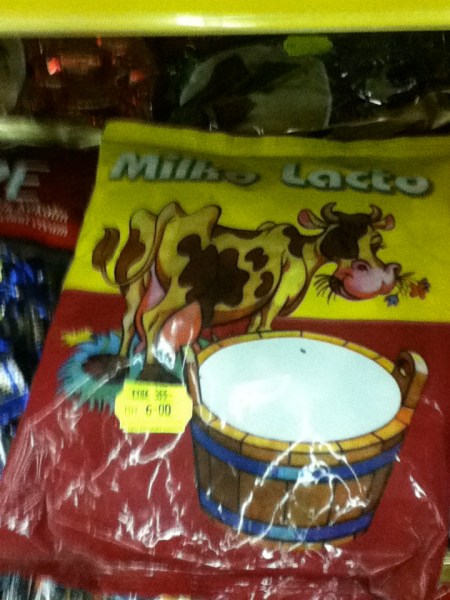Milko Lacto candy package with a cow and a large pail of milk pictured on it titled milko lacto