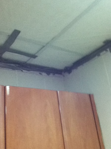 plastic sheeting taped up to the ceiling with duct tape
