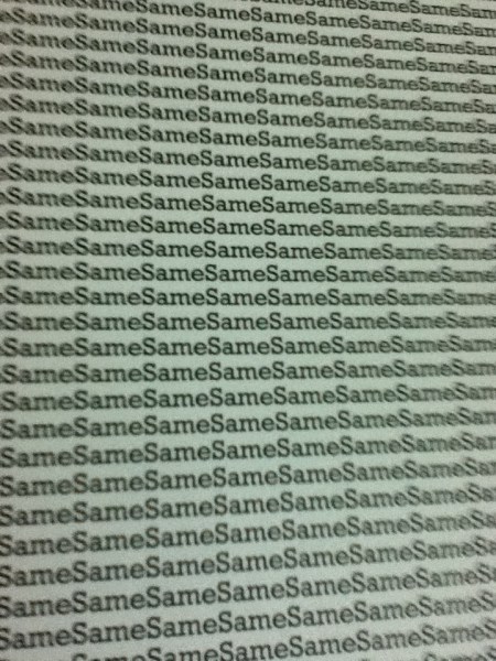 Same Book Closeup close up of the cover showing the word "same" repeated over and over
