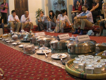 Iftar Meal containers of food laid out on the carpet