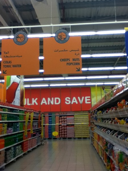 grocery aisle sign "cheeps nuts popcorn"