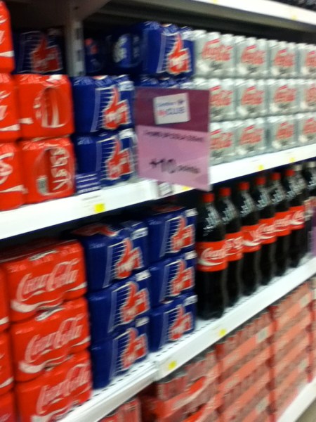 grocery shelves containing Thums Up brand soda