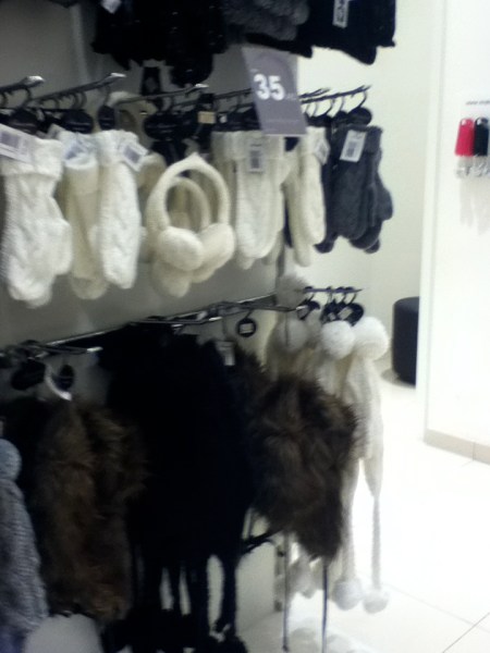 Stocking Caps store rack of gloves, ear muffs, and stocking caps