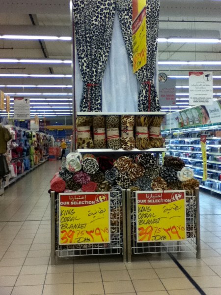 store display of animal print fleece blankets