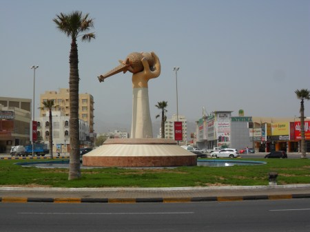 Perfume Roundabout statue of a hand holding a perfume bottle