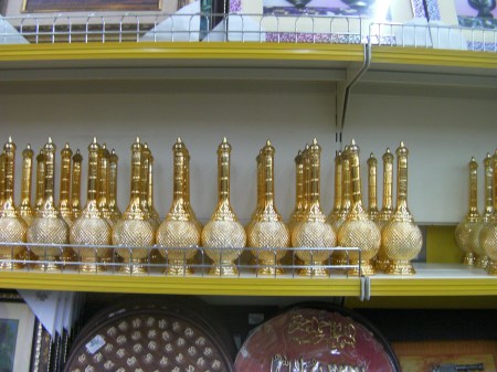 Genie Bottles golden bottles, long neck above a bulbous bottom