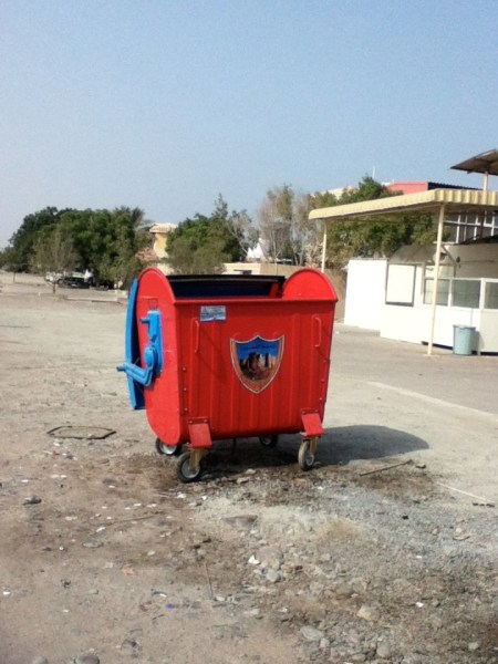 New Dumpster red and blue dumpster with city emblem on the front
