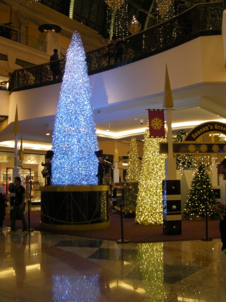 Christmas trees in the mall covered in lights