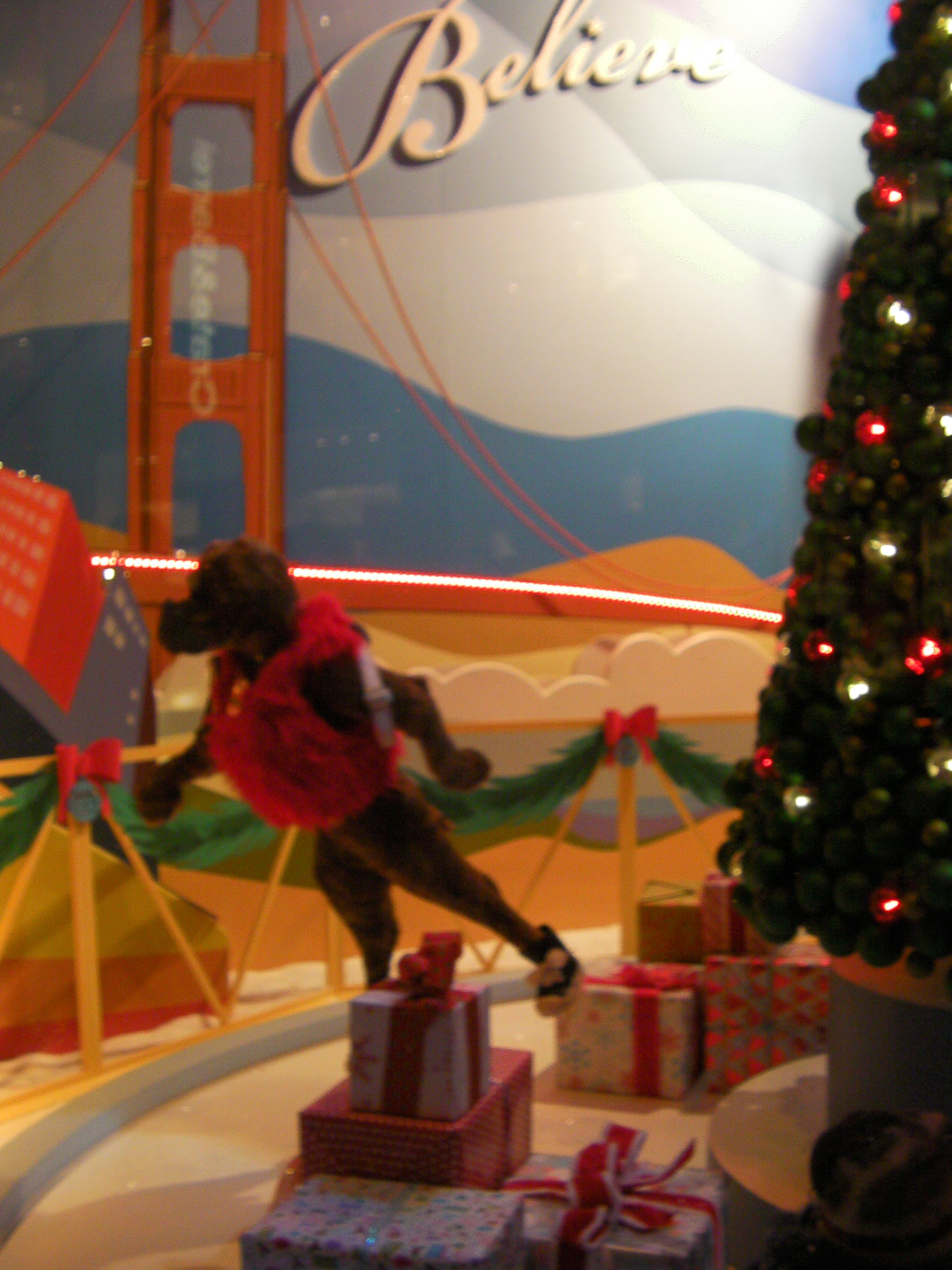 animatronic display of figures skating around a Christmas tree