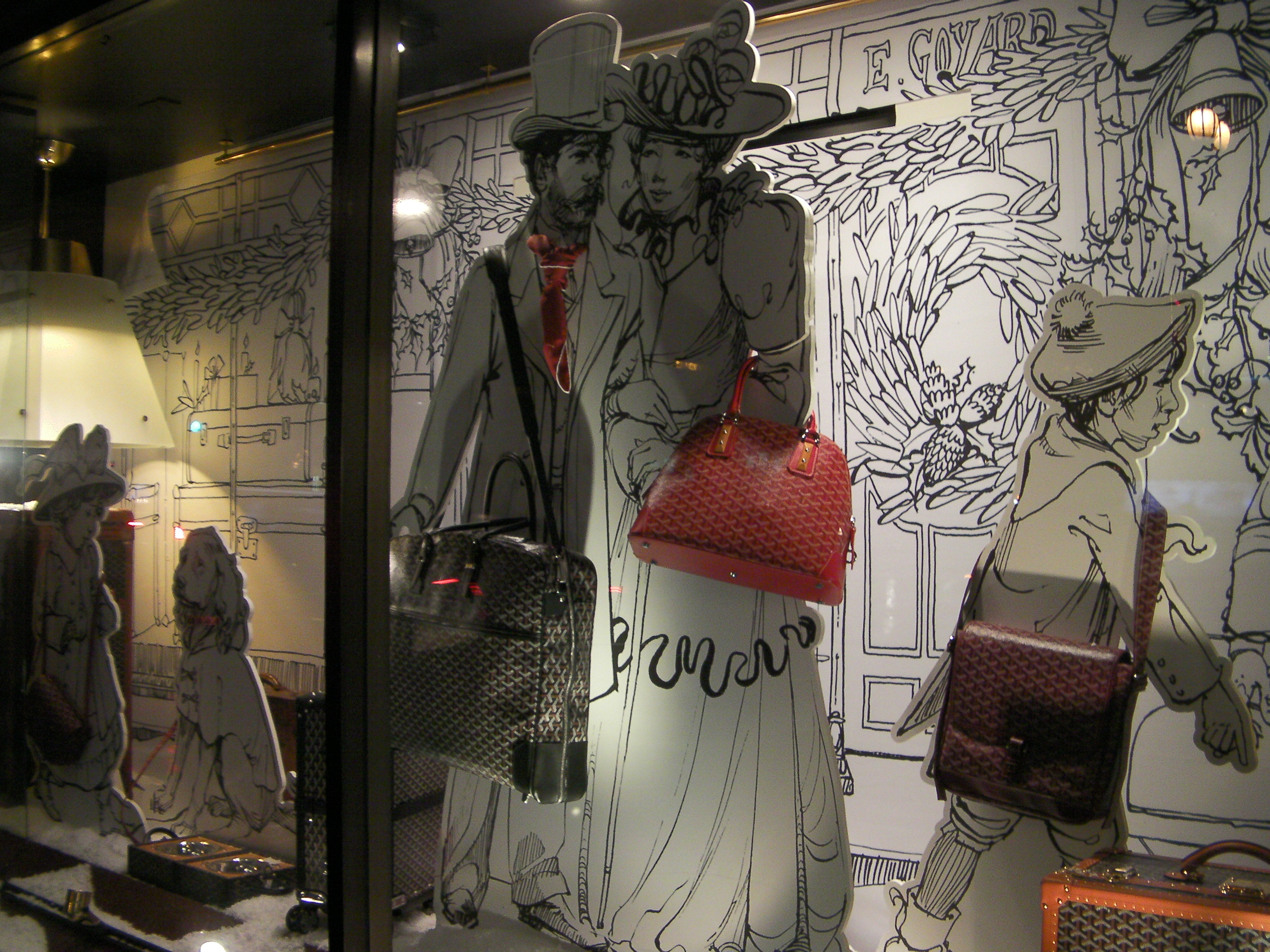 window display of Victorian people with handbags