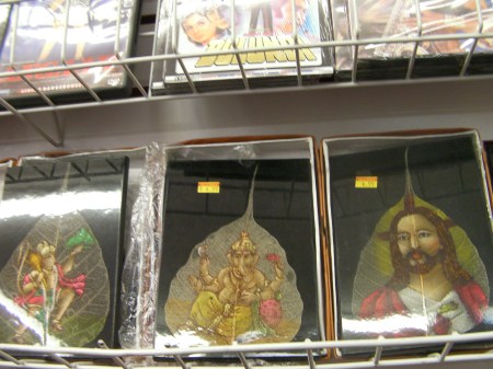 shelf containing hand painted pictures on leaves