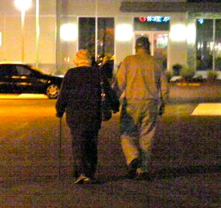 couple walking away holding hands