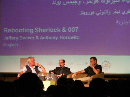 three men on a stage