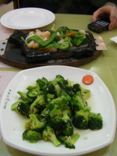 plate of broccoli, plate of shrimp and vegetables