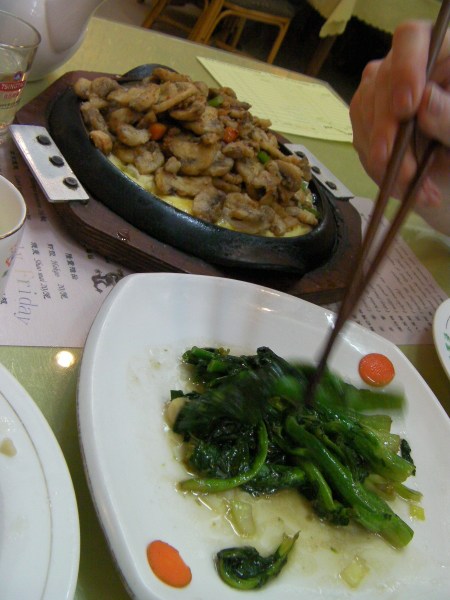 plate of broccoli leaves, plate of egg and mushrooms