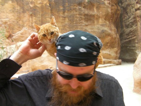 cat on man's shoulders