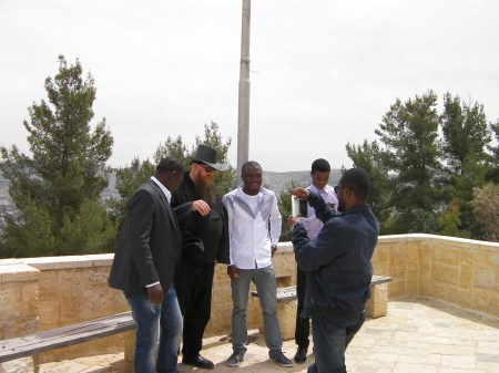 bearded man with 4 Nigerians 